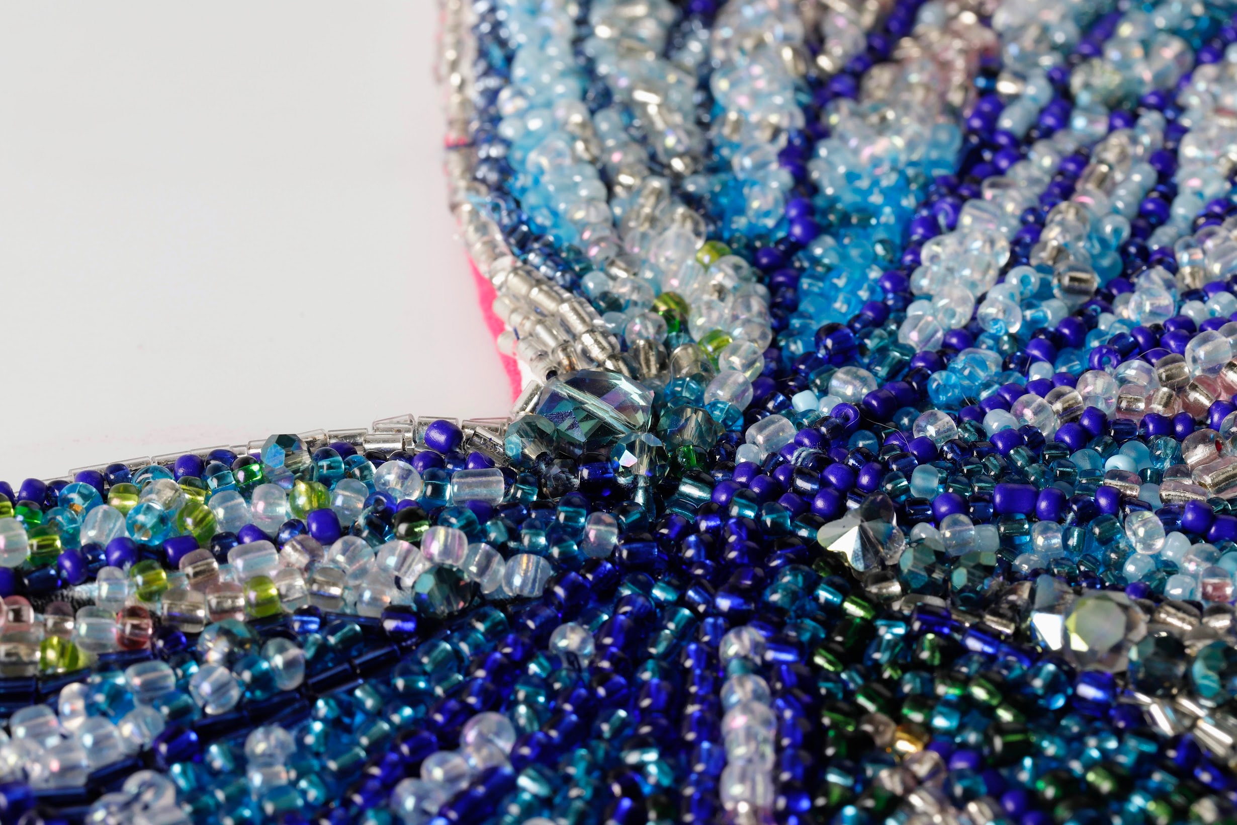 Hand-beaded piece — blue and silver seed bead close-up