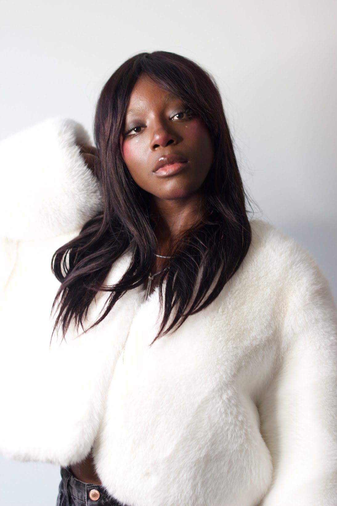 Noa Omane in white fur coat — studio portrait